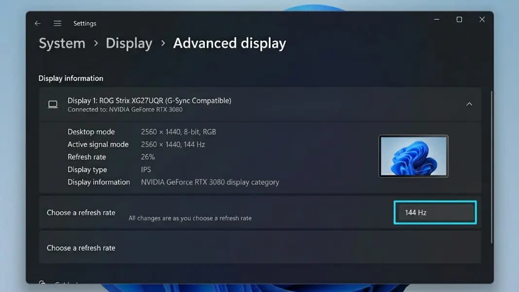 Windows 11 Advanced Display Settings panel showing the refresh rate dropdown set to 144 Hz, monitor model and current resolution displayed, with the Choose a Refresh Rate option highlighted in blue Windows 11 Advanced Display Settings panel showing the refresh rate dropdown set to 144 Hz, monitor model and current resolution displayed, with the Choose a Refresh Rate option highlighted in blue